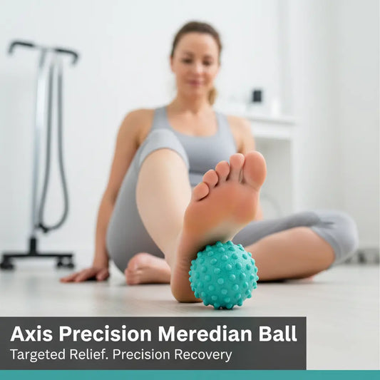 Female patient rolling foot on Axis Precision Meridian Ball in physiotherapy clinic - Targeted Relief. Precision Recovery.